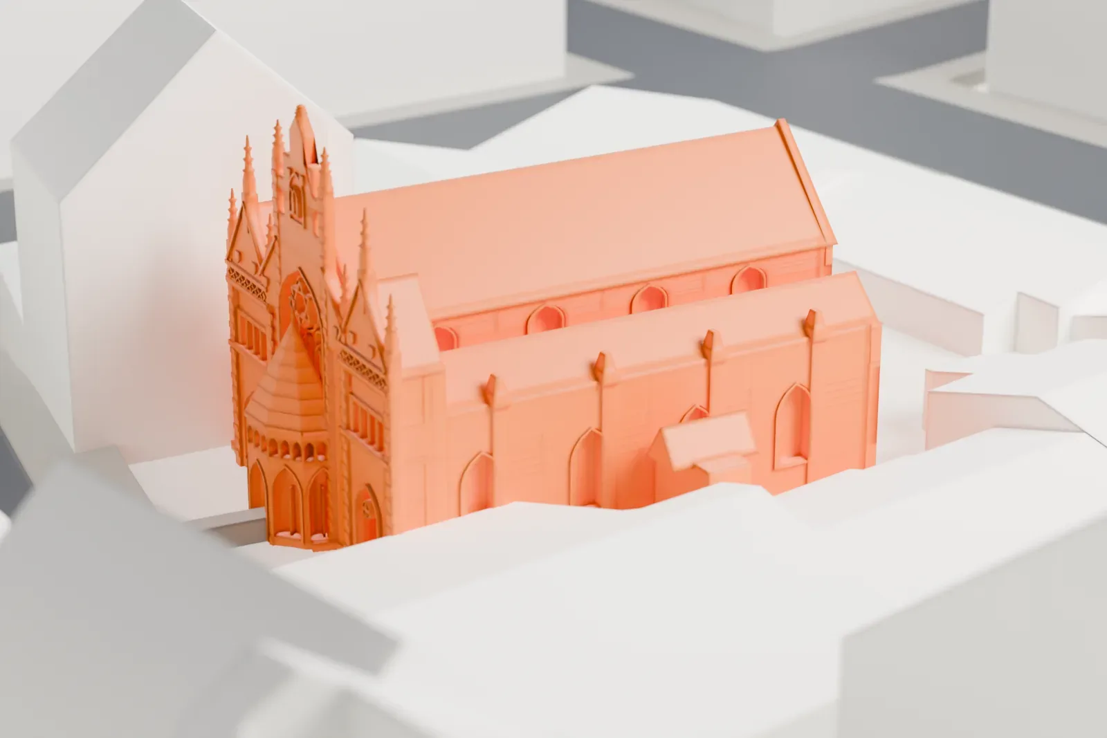 A white 3D print of the Maisel Synagogue in Prague's former Jewish quarter, among the surrounding streets and buildings of the old city.