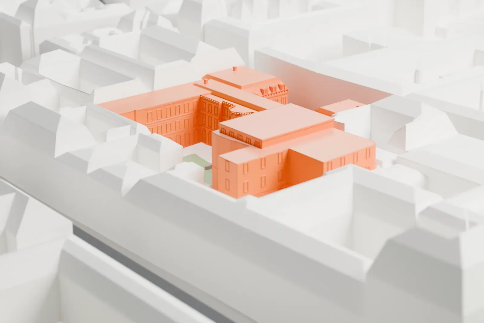 A white 3D print of the Maison de la Chimie, a conference building among surrounding city streets and buildings.