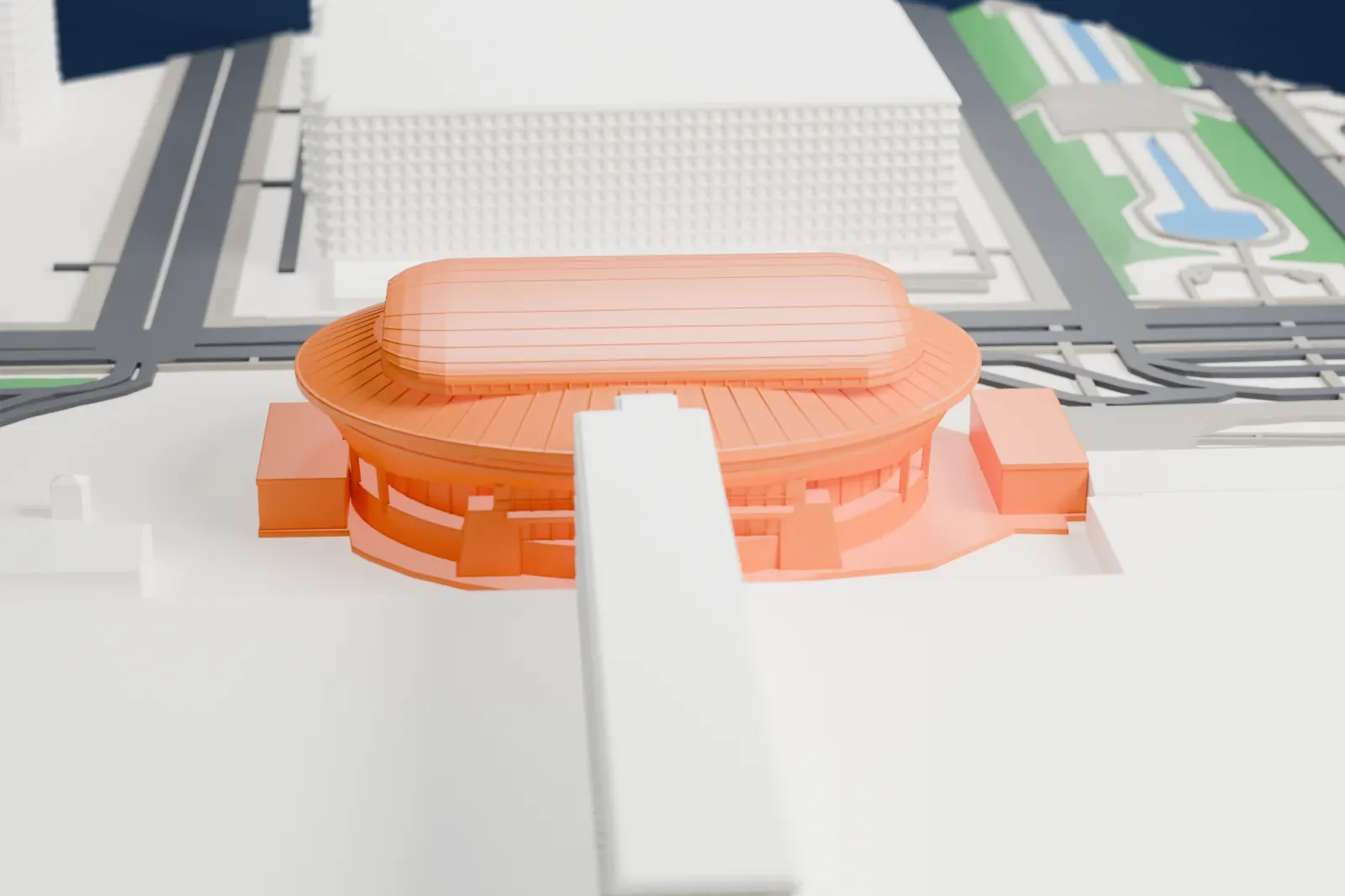 A white 3D print of Makuhari Messe among the surrounding streets and buildings.