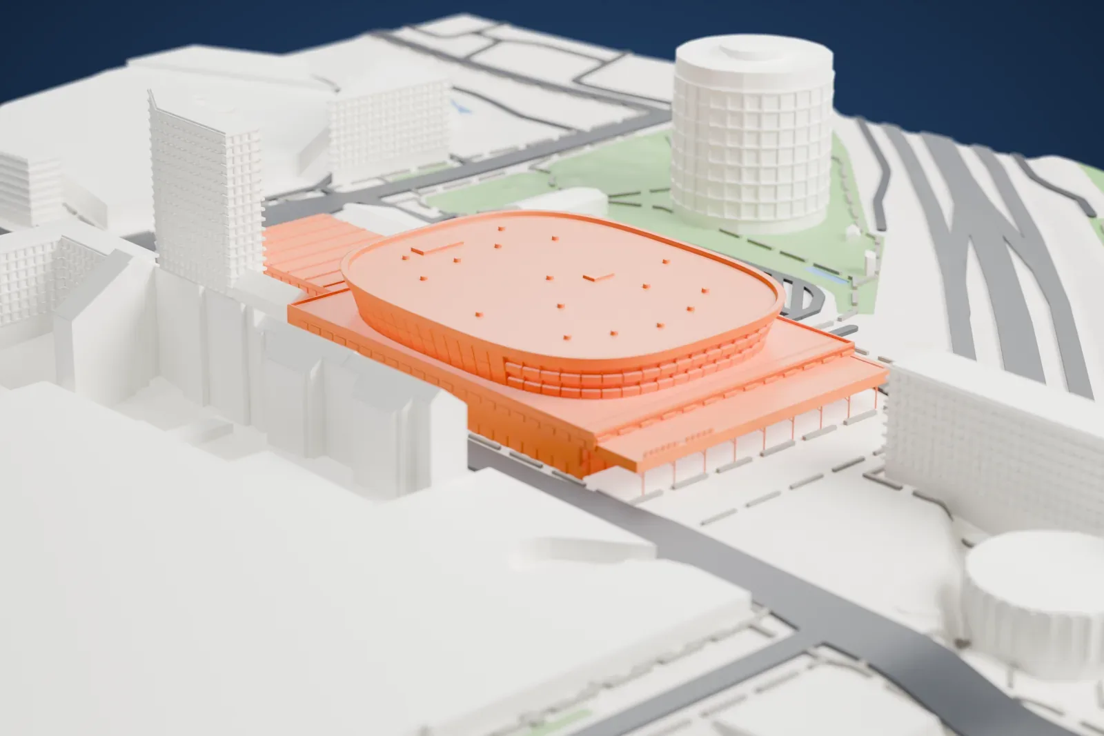 A white 3D print of Malmö Arena, a rounded drum under a flat roof with an entrance canopy along one side, among the streets and buildings around it.