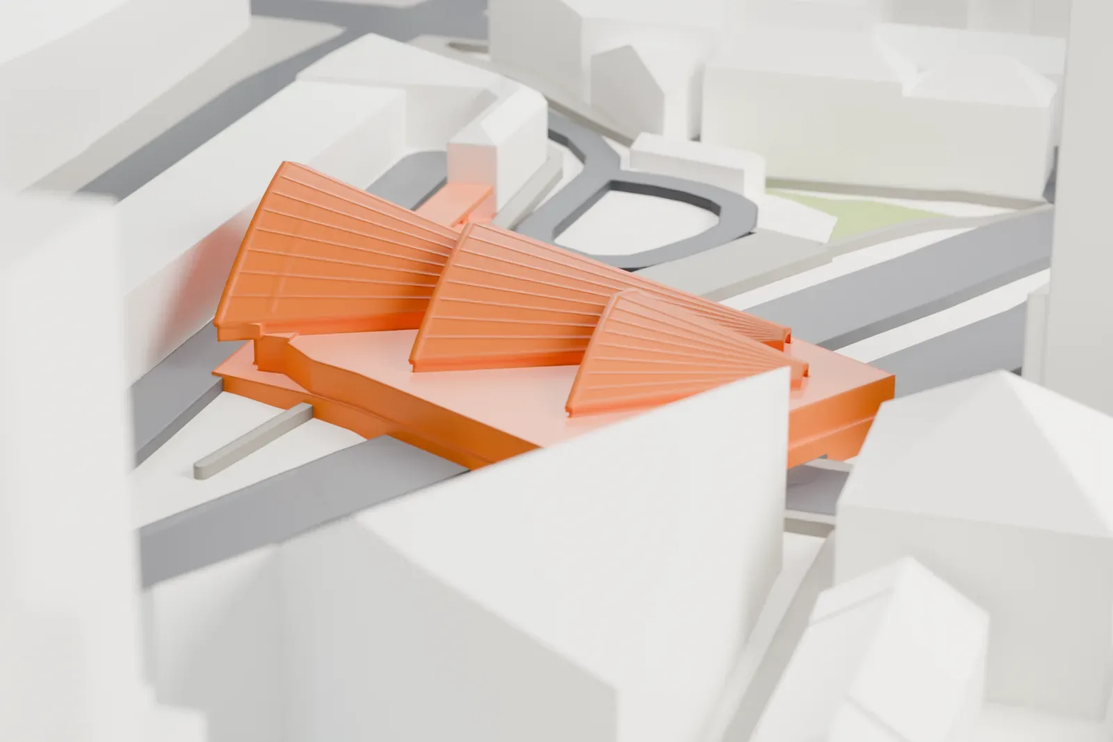 A white 3D print of Manchester Oxford Road railway station, with the surrounding streets and buildings of the city center.