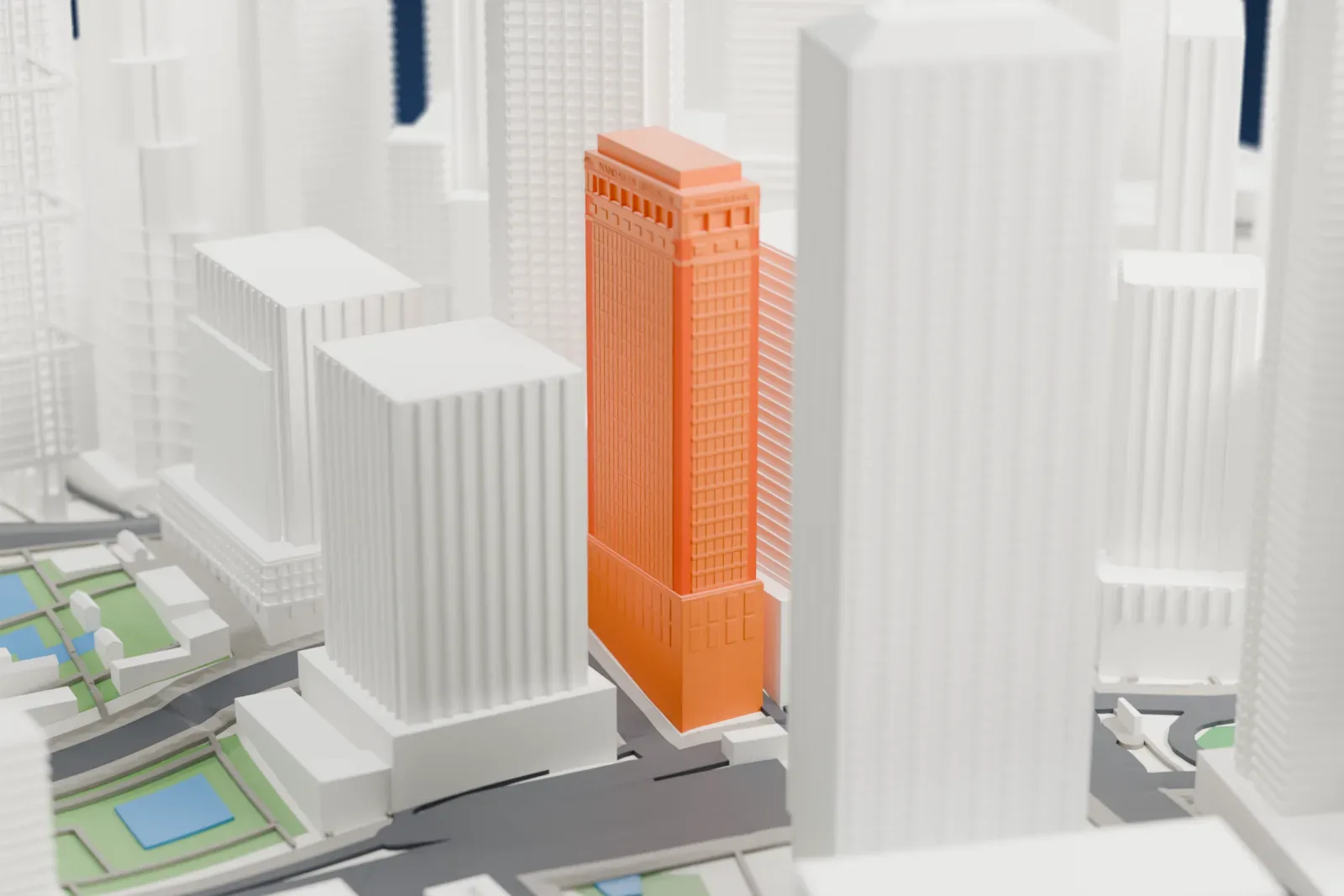 A white 3D print of the Mandarin Oriental, Hong Kong, with the surrounding streets and buildings of Central around it.