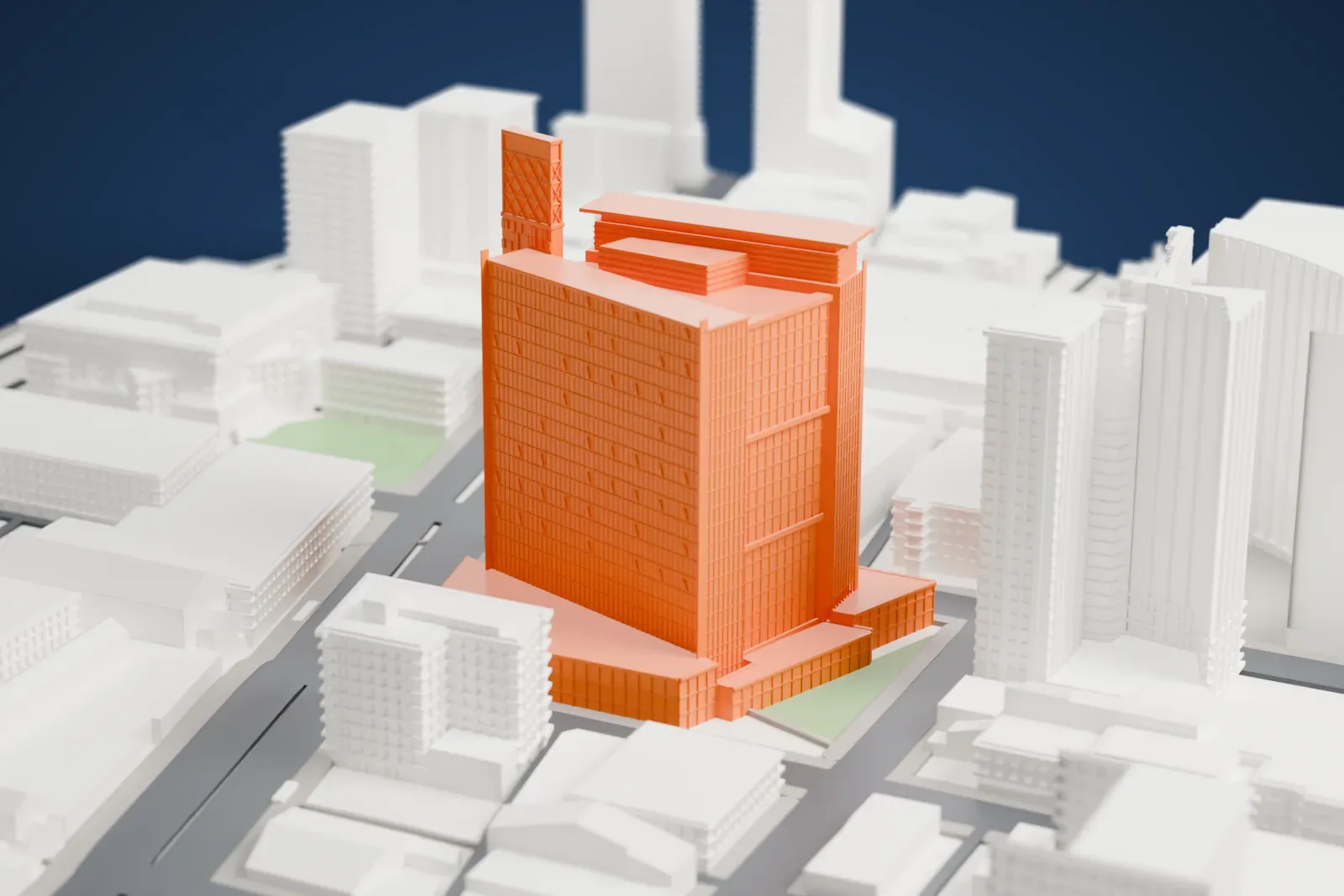 A white 3D print of Manitoba Hydro Place with the surrounding streets and buildings.