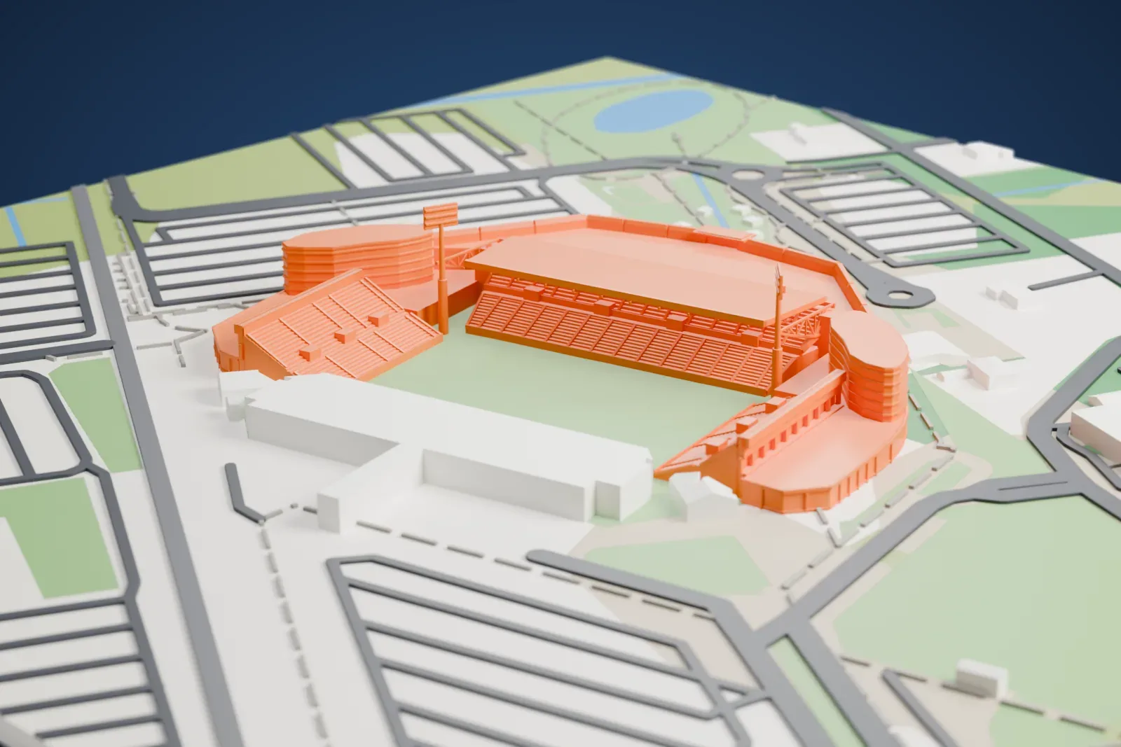 A white 3D print of Mapei Stadium – Città del Tricolore, a covered side stand facing two open ends with floodlight towers at the corners, among the streets and buildings around it.
