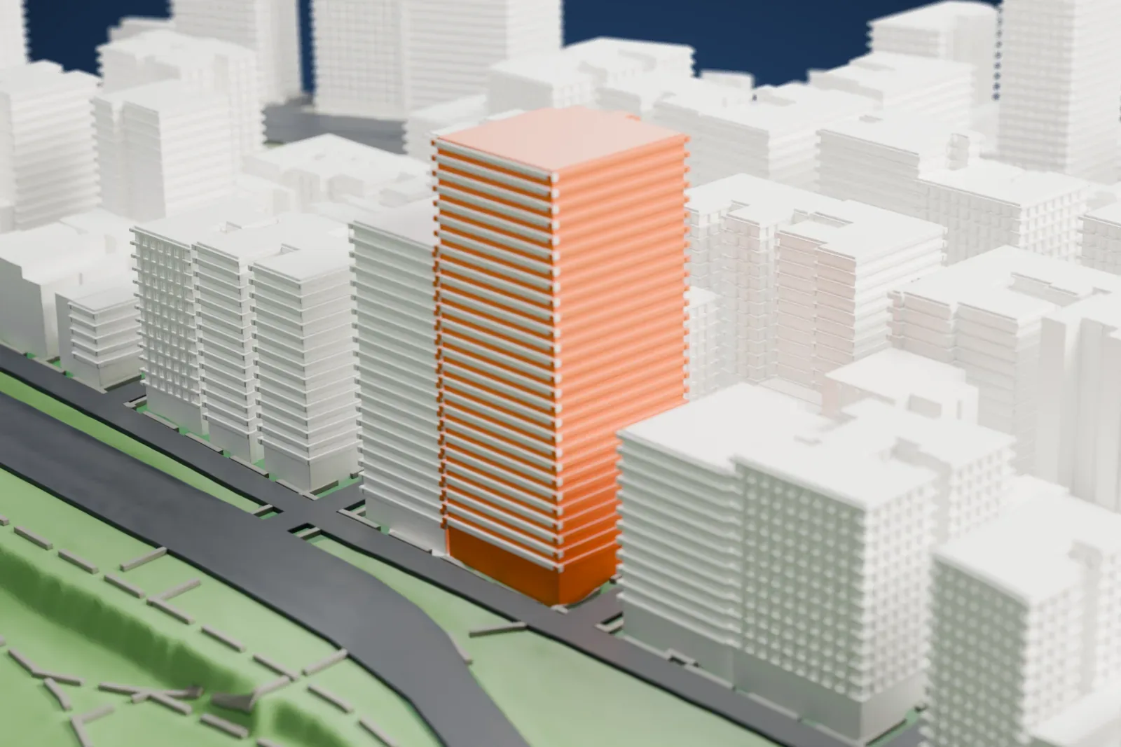 A white 3D print of the Master Apartments, a tall tower whose upper floors step in toward a narrow crown, beside a green park and surrounded by city buildings.