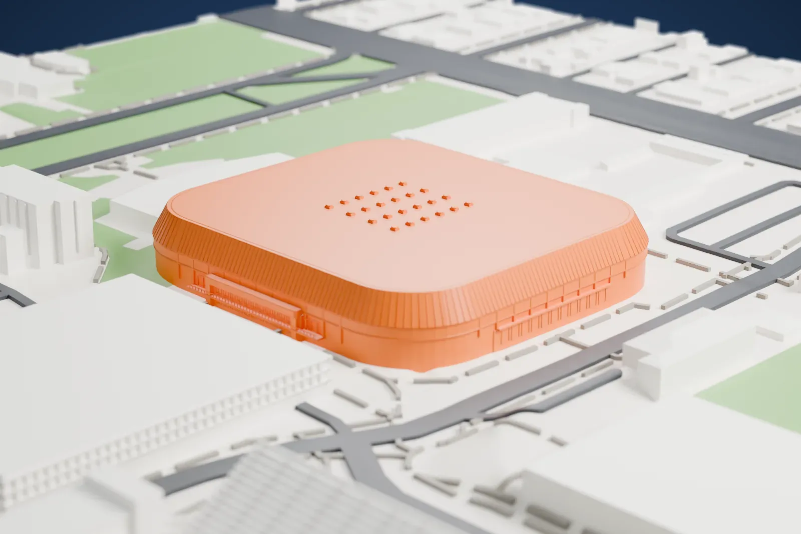 A white 3D print of McKale Center, a wide, low arena with a rounded-rectangle roof marked by a grid of small round details, surrounded by green areas, roads and buildings.
