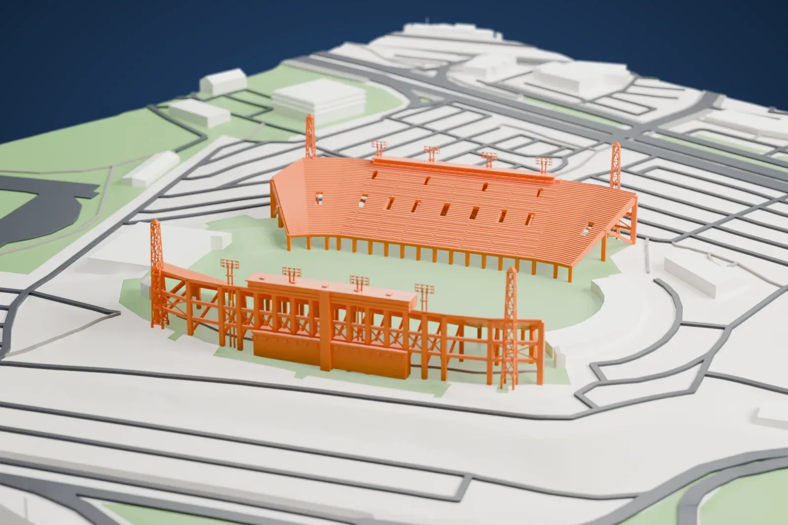 A white 3D print of McMahon Stadium, with its two open grandstands, tall lattice towers and surrounding streets and buildings.