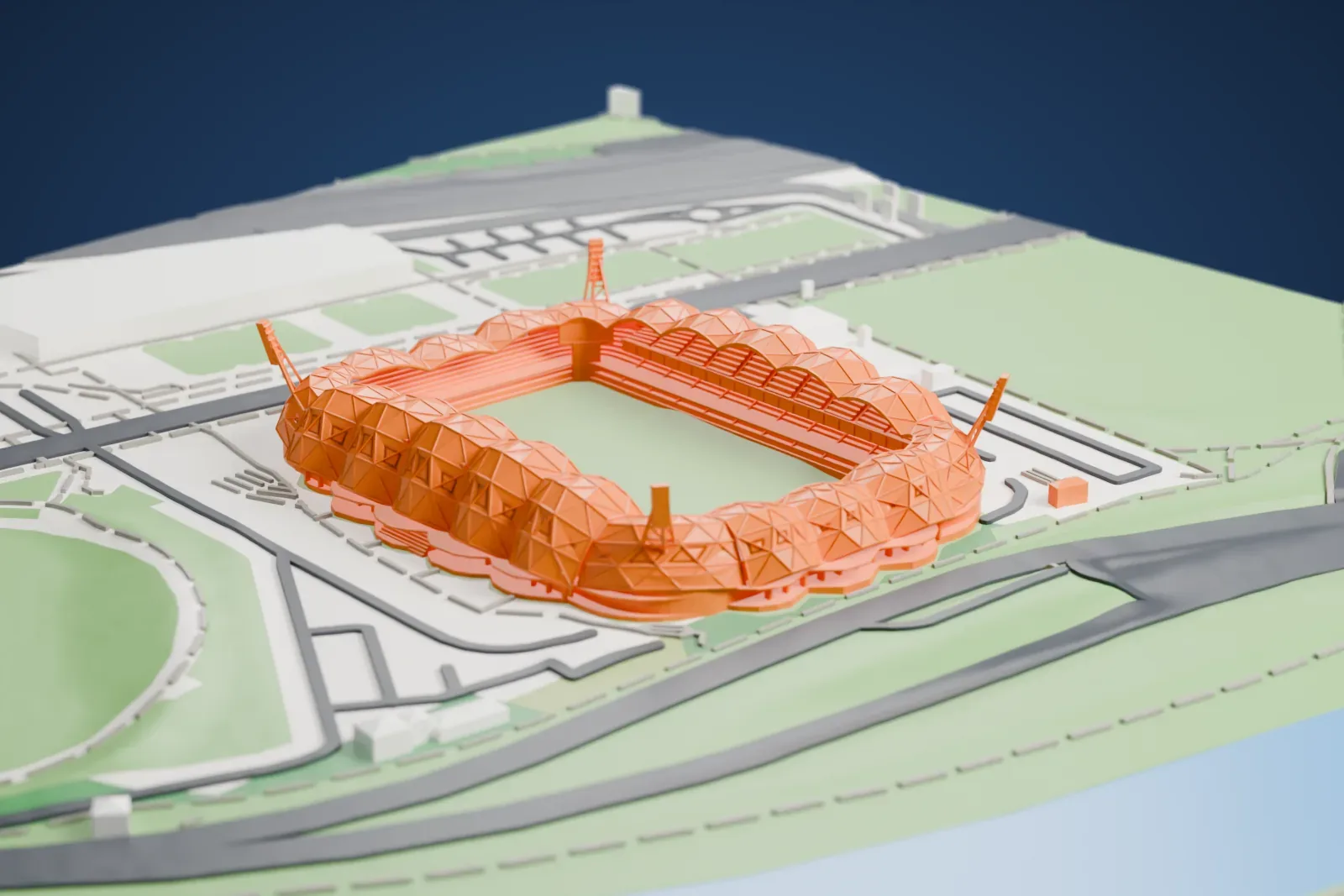 A white 3D print of Melbourne Rectangular Stadium, a football stadium wrapped in a lattice of triangular roof members with slim masts at its corners, beside roads, green parkland and water.