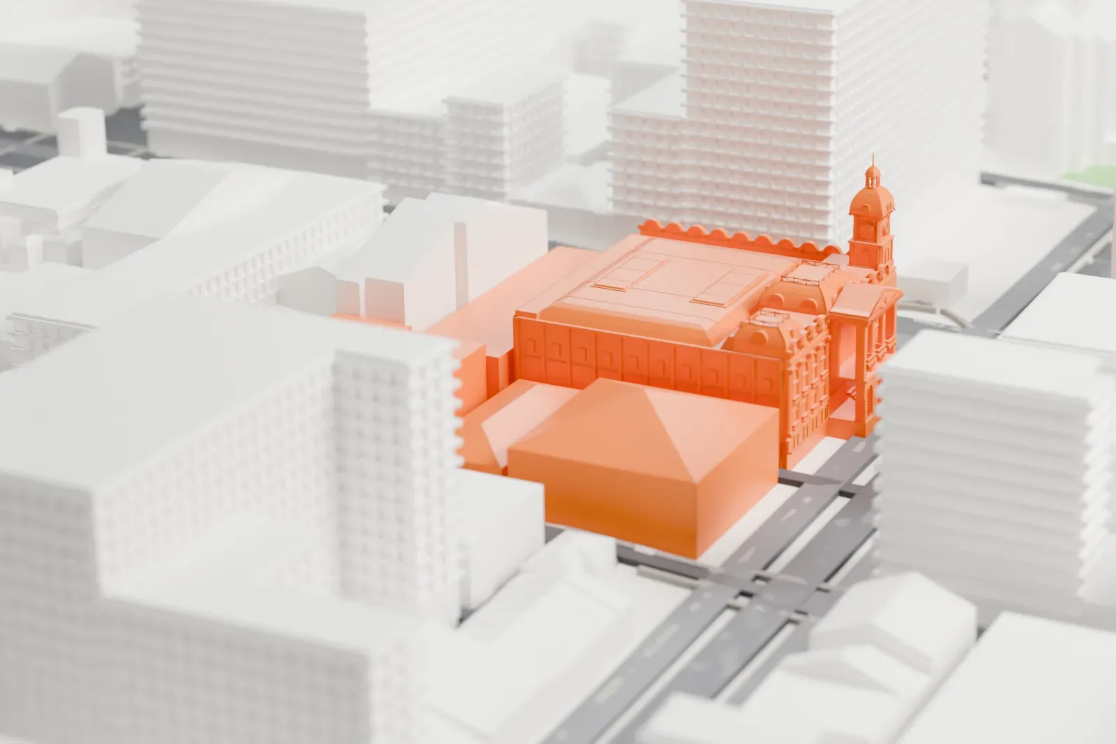 A white 3D print of Melbourne Town Hall, a large Victorian building with a corner clock tower topped by a small dome, surrounded by taller city blocks and streets.