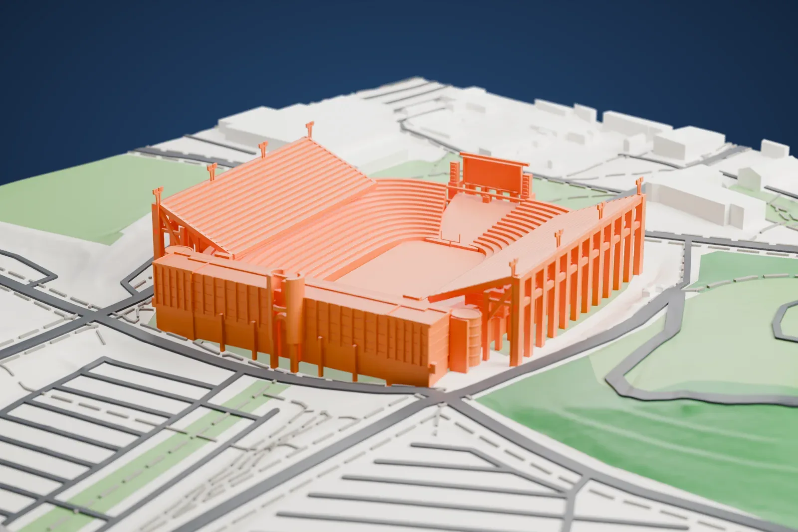 A white 3D print of Memorial Stadium at Clemson, an open bowl of tiered seating with rows of tall exterior columns, surrounded by roads and green fields.