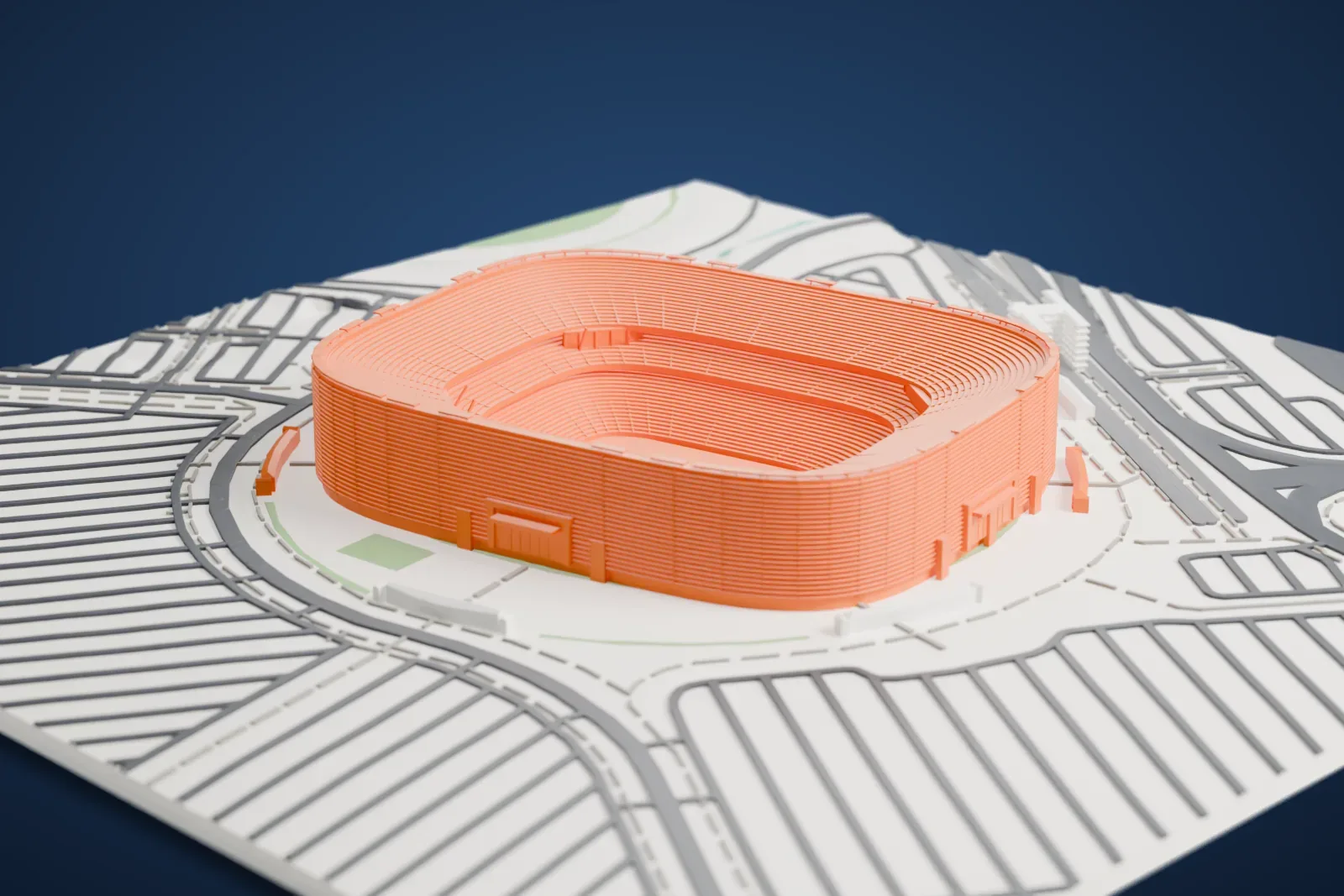 A white 3D print of MetLife Stadium, an open oval bowl of stacked seating tiers inside a ribbed outer wall, surrounded by paved parking areas and looping roads.