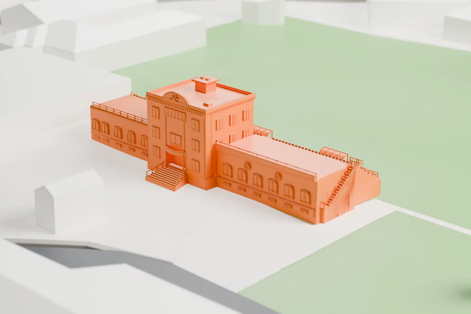 A white 3D print of MFF Football Centre, a stepped terrace beside a boxy building block with an outside staircase, set among surrounding streets and buildings.