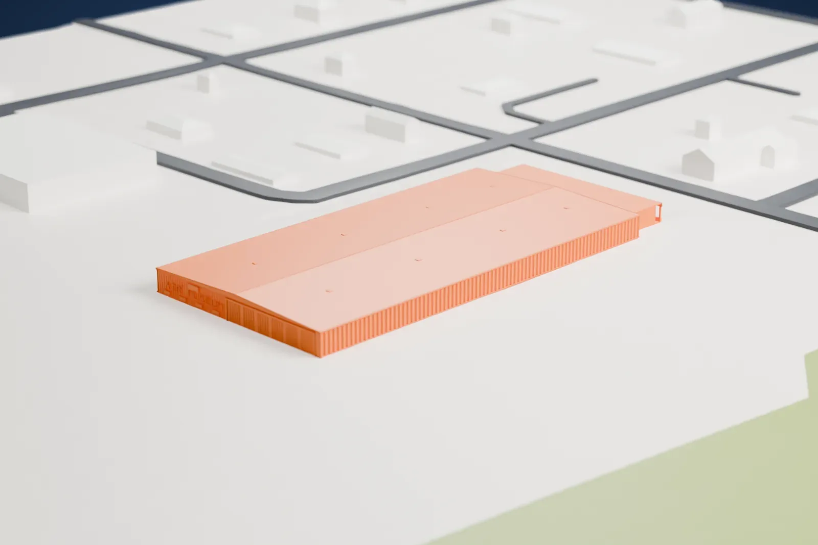 A white 3D print of the Mid-America Air Museum hangar, a long, low building with a gabled roof, ribbed doors along one side and lettering on one end, standing on open flat ground with a few small buildings and roads nearby.