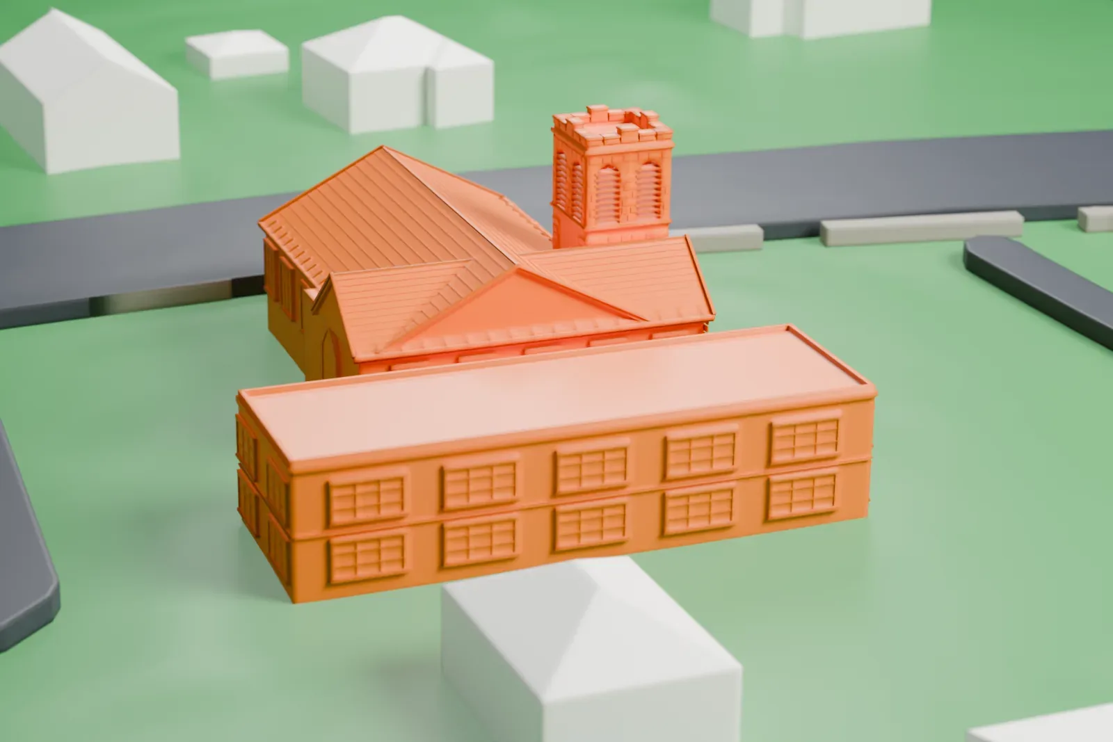A white 3D print of a church with a square tower beside a long two-story wing, set among green lawns and quiet roads.