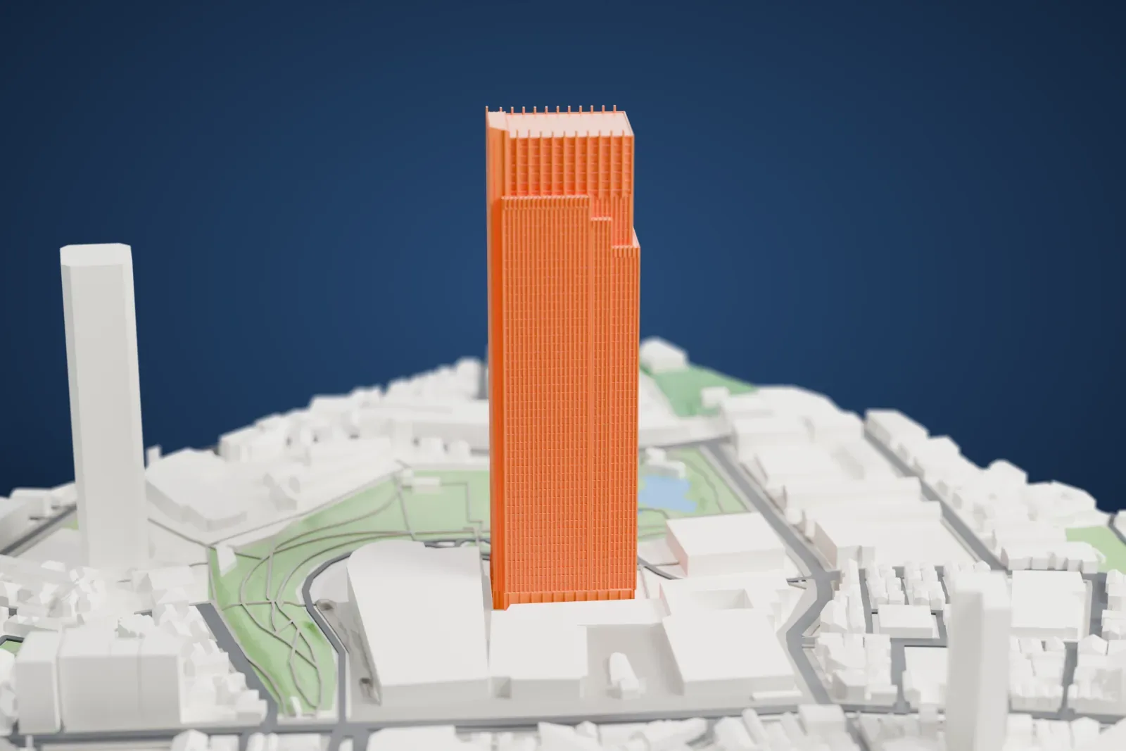 A white 3D print of Midtown Tower rising above the surrounding city buildings in Tokyo.