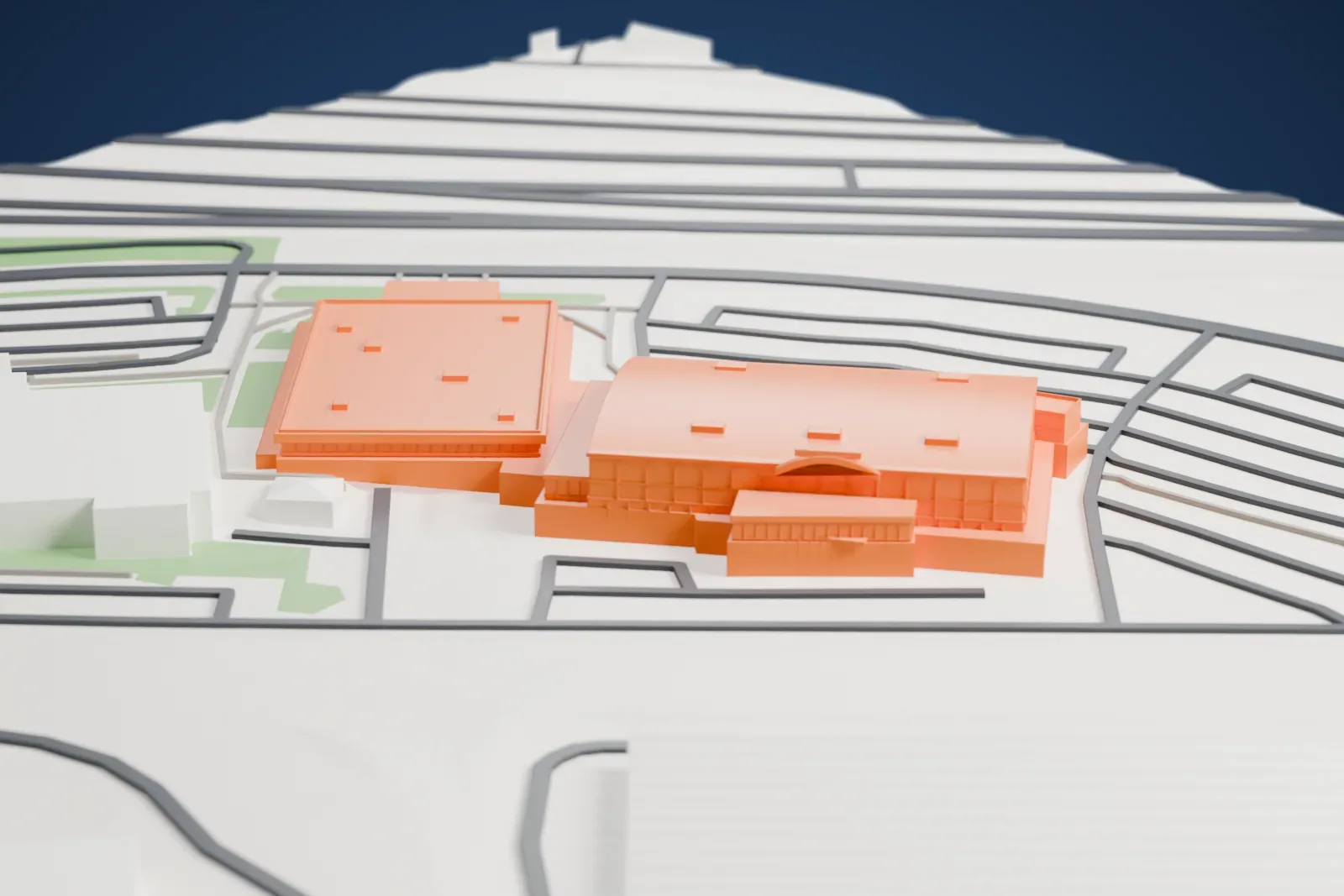 A white 3D print of the Mississauga Sports and Entertainment Centre with the surrounding streets and buildings.