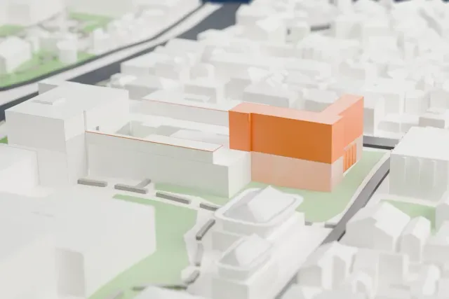 A white 3D print of the MMCA Seoul model in Seoul, with the streets around it.