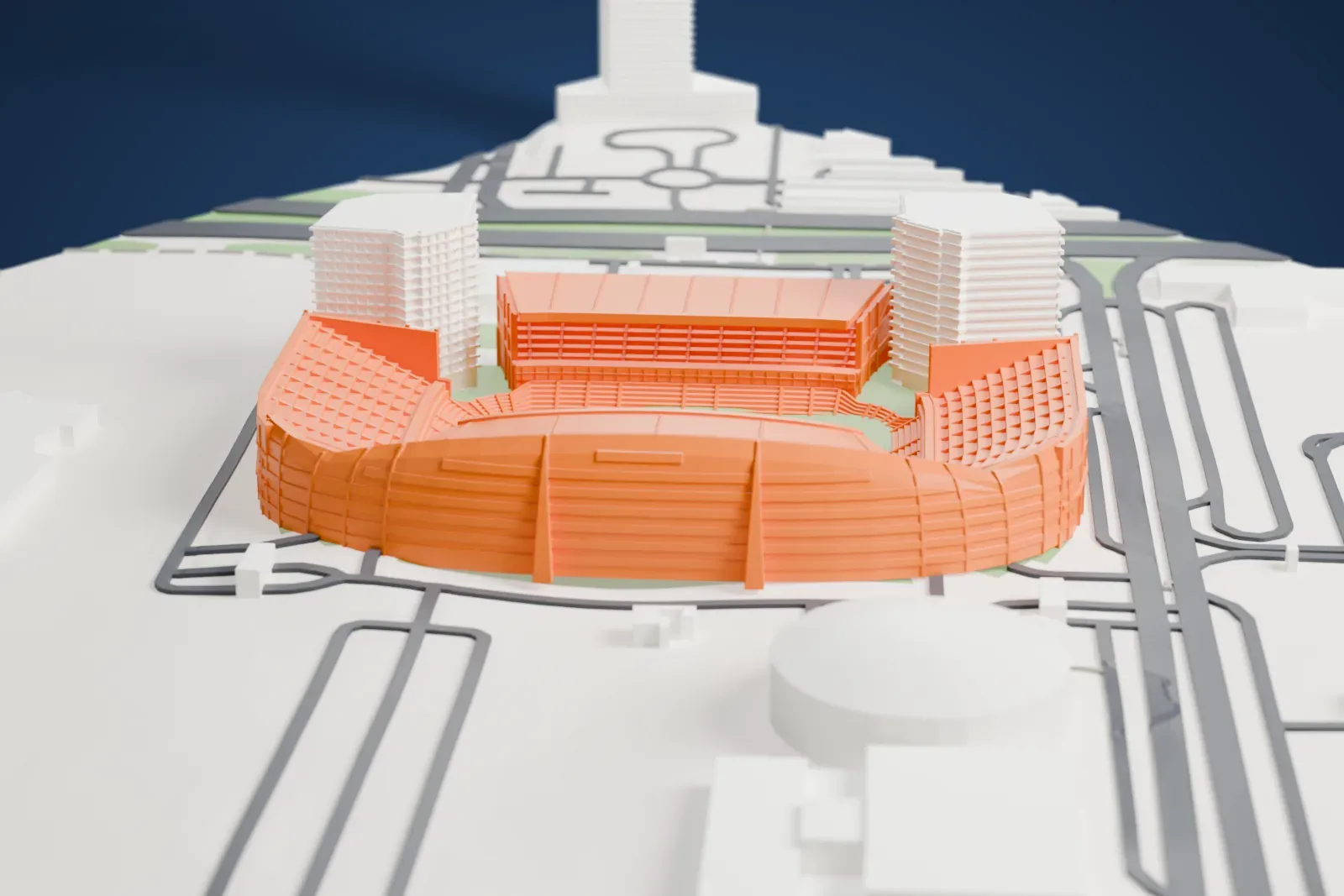 A white 3D print of the Mohammed bin Zayed Stadium, a bowl with a domed, banded shell and two pointed fins over one stand, among the surrounding streets and buildings.