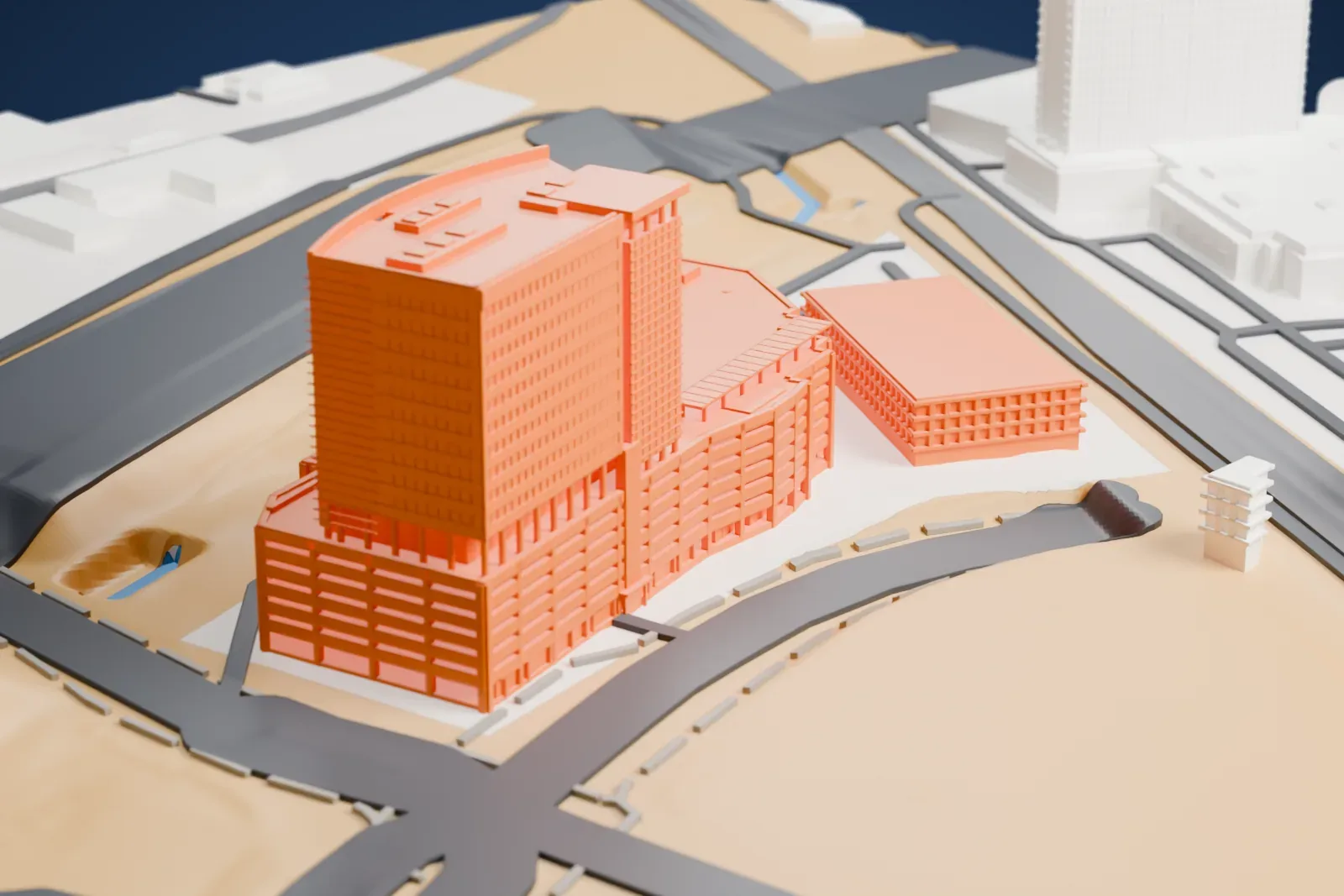 A white 3D print of Molasky Corporate Center, a curved tower with a window grid rising from a long, low banded base, with roads and open ground around it.