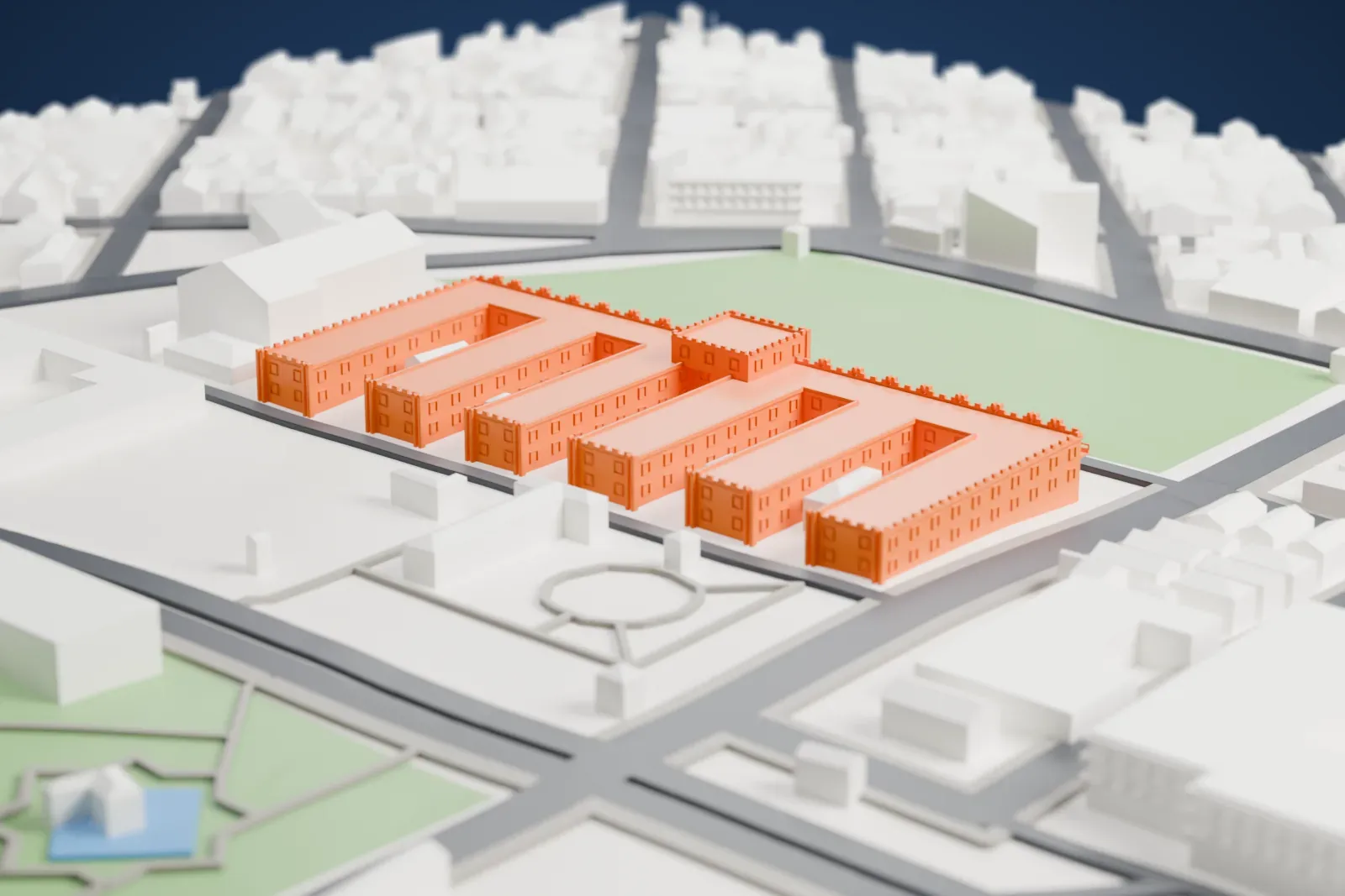 A white 3D print of the Moncada Barracks, a long low compound with a central tower and exterior stairs, set among surrounding streets and buildings.
