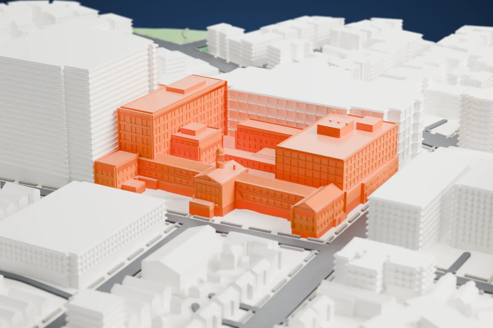 A white 3D print of the Montefiore Home for Chronic Invalids, a group of joined brick buildings of different heights, surrounded by taller buildings and city streets.