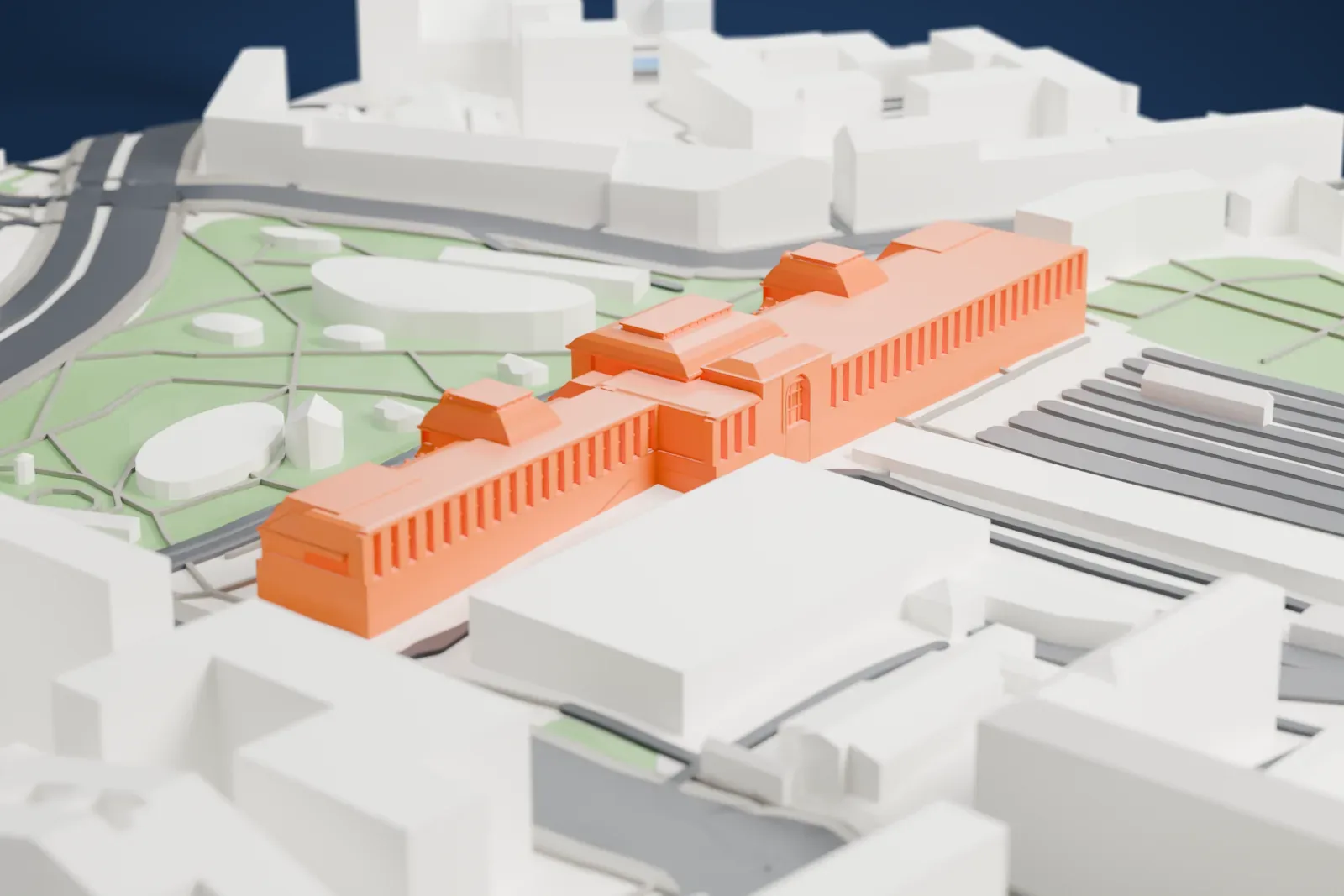 A white 3D print of the Moscow Paveletsky railway station with the surrounding streets and buildings.