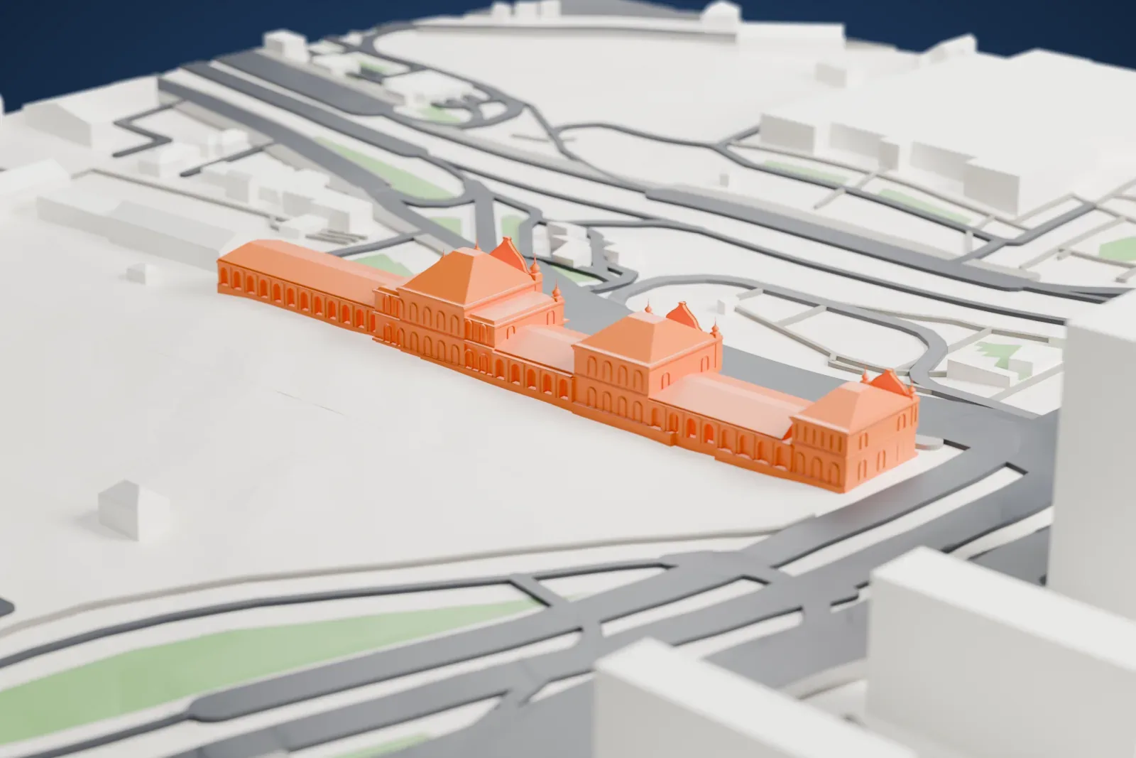 A white 3D print of the Moscow Rizhsky railway station, a station building standing among surrounding streets and other buildings.