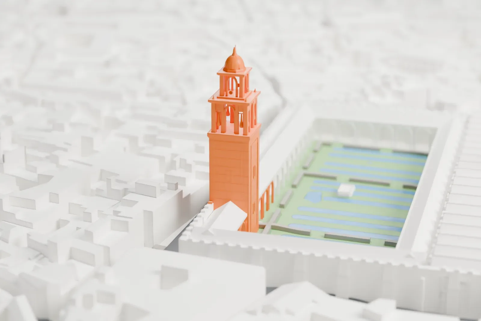 A white 3D print of the Mosque-Cathedral of Córdoba, a broad rectangular building with rows of parallel roofs, a raised central nave, an arcaded courtyard and a bell tower, among dense old-town blocks near a river.