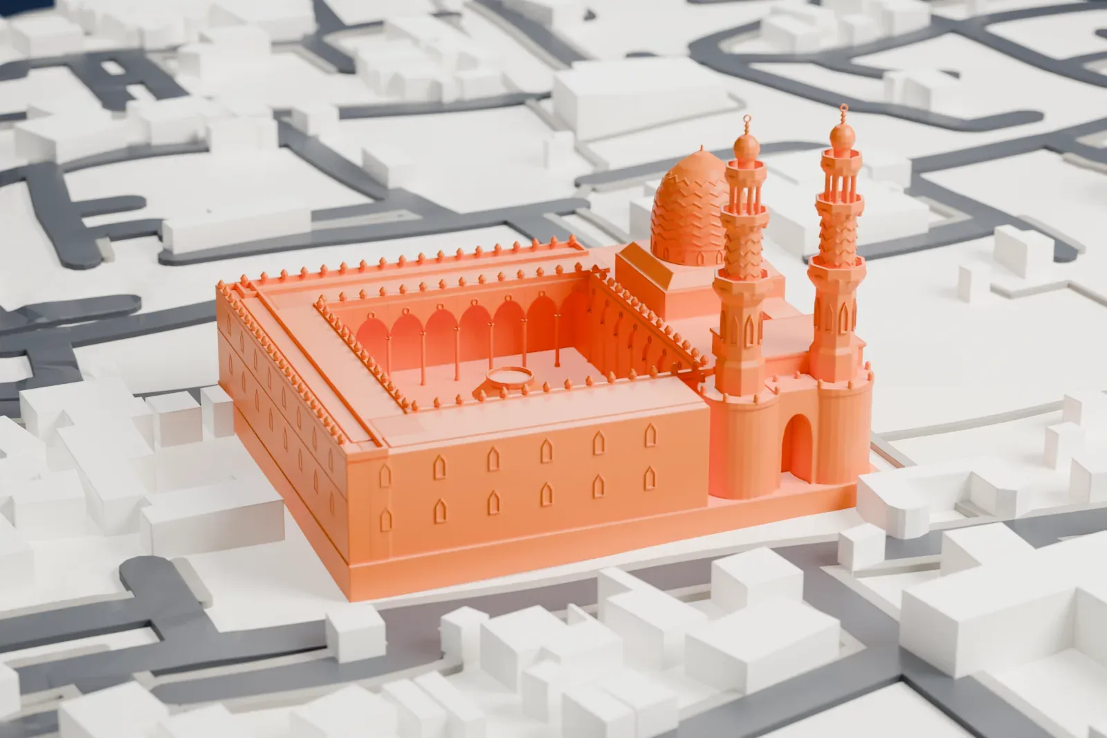 A white 3D print of the Mosque of Sultan al-Muayyad on al-Mu'izz Street in Islamic Cairo, standing among surrounding city buildings.
