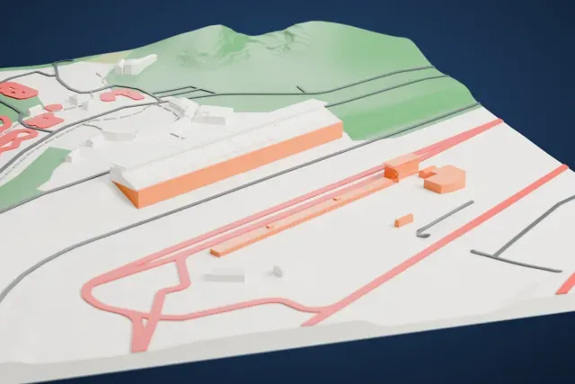 A white 3D print of the Mobility Resort Motegi Main Grandstand model in Motegi, with the streets around it.