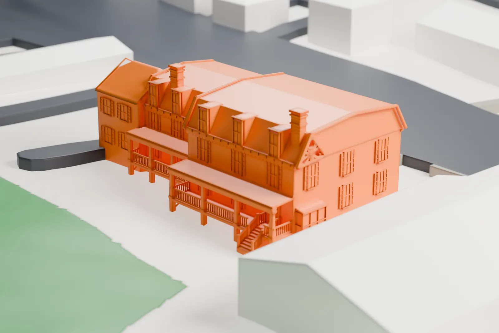 A white 3D print of the Mount Kemble Home, a large multi-winged building with dormers, chimneys and porches, beside a street and green hillside.