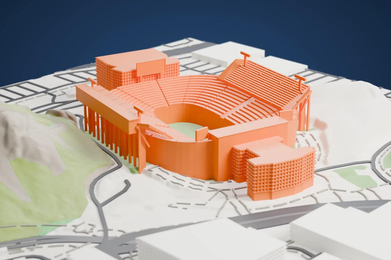 A white 3D print of Mountain America Stadium, a bowl of curved seating tiers with a tall rear stand, set between hills with campus buildings and roads around it.