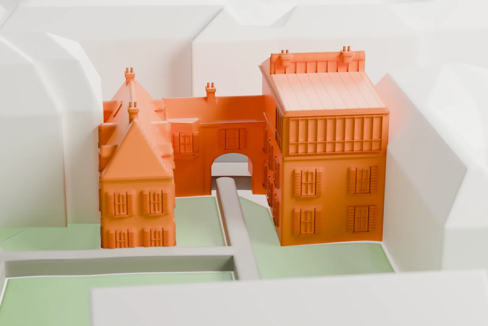A white 3D print of the Musée de Montmartre among the surrounding streets and buildings of Montmartre in Paris.