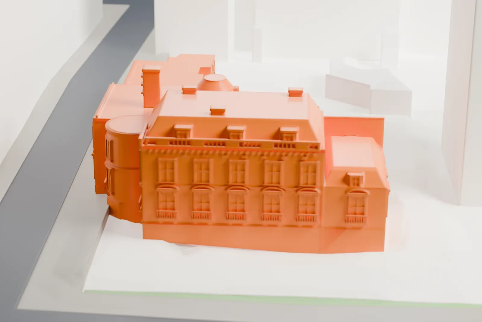A white 3D print of the Musée Marmottan Monet, a low museum building, among the surrounding streets and buildings of Paris.