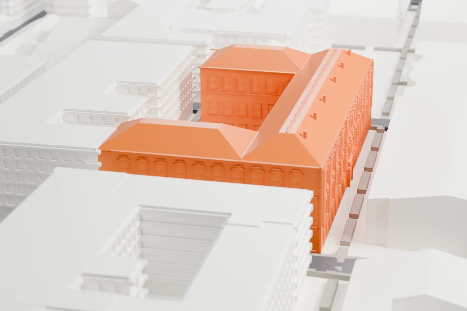 A white 3D print of the Museo Egizio with sloped roofs and an inner courtyard among closely packed buildings and narrow streets.
