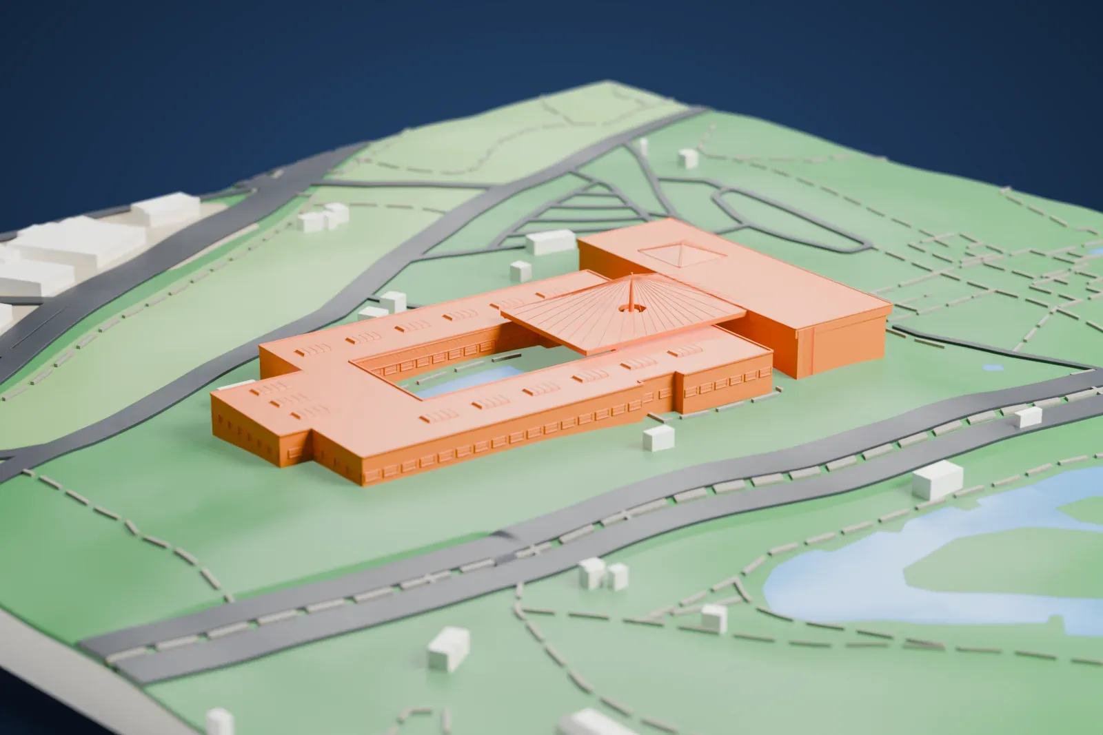 A white 3D print of the National Museum of Anthropology, a low rectangular building around an open courtyard with a fan-shaped roof, set in a large green park with roads and ponds.