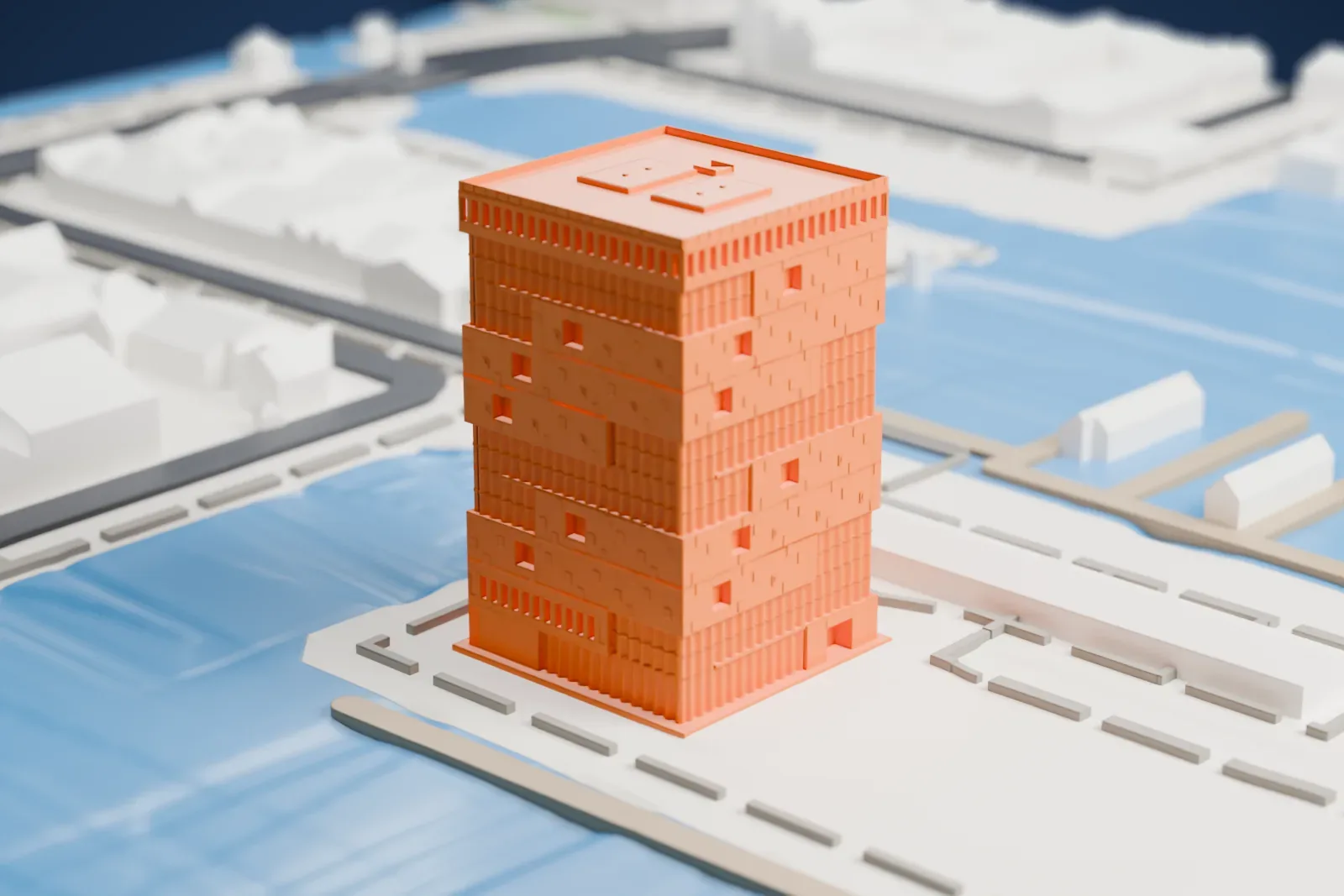 A white 3D print of the Museum aan de Stroom, a tower of stacked boxes with ribbed bands and a flat roof, standing on a paved waterfront beside water.