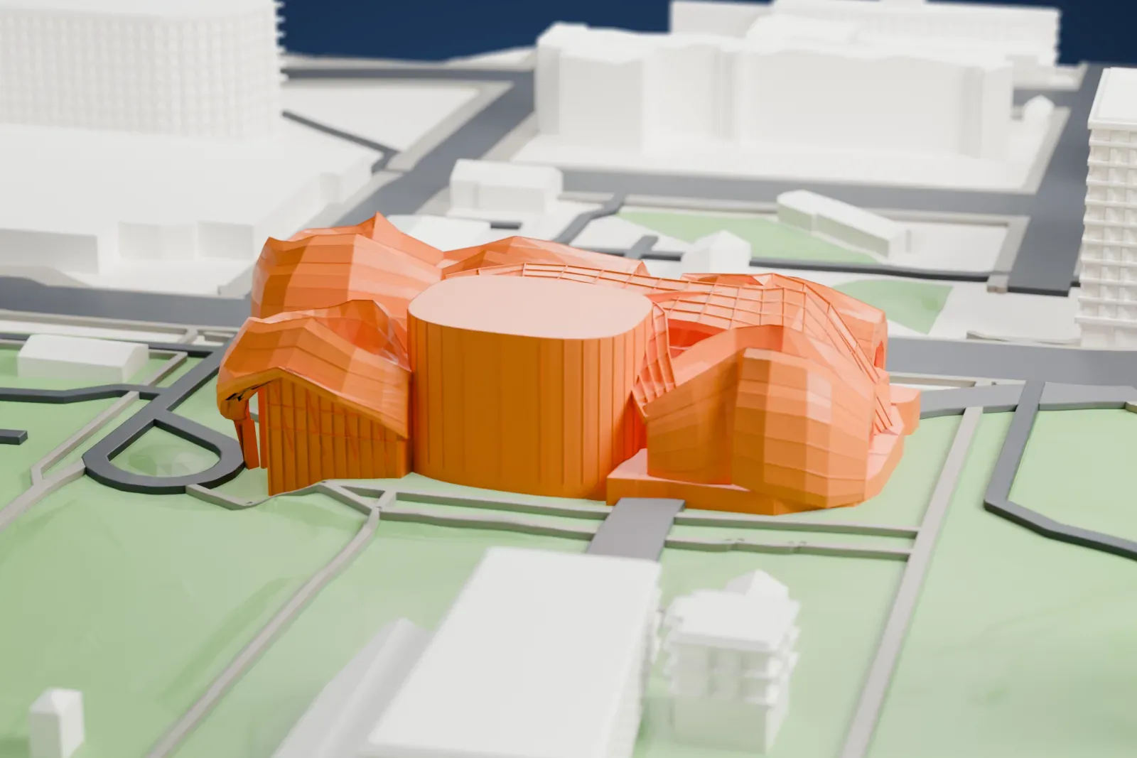 A white 3D print of the Museum of Pop Culture in Seattle, with the surrounding streets and buildings.
