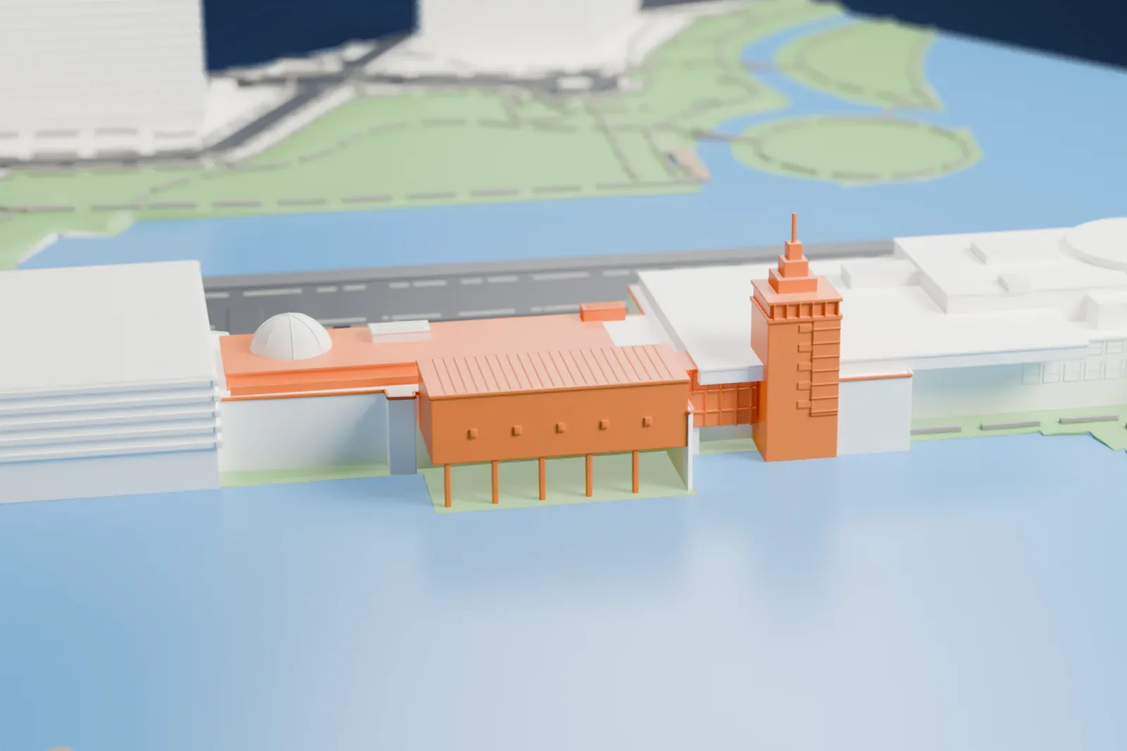 A white 3D print of the Museum of Science, a long low building with a tower and domes on a park strip, surrounded by river water and nearby buildings.