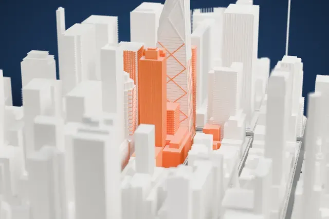 A white 3D print of the Museum Tower model in New York, with the streets around it.