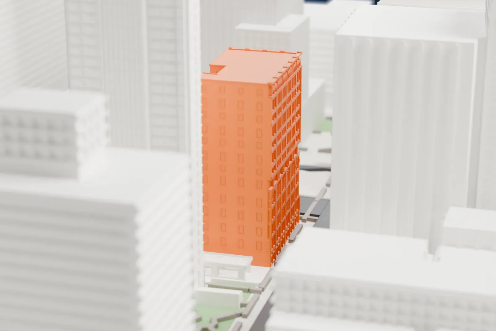 A white 3D print of the Mutual Reserve Building, a tall block of many stories with rows of windows, standing among taller towers and smaller buildings.