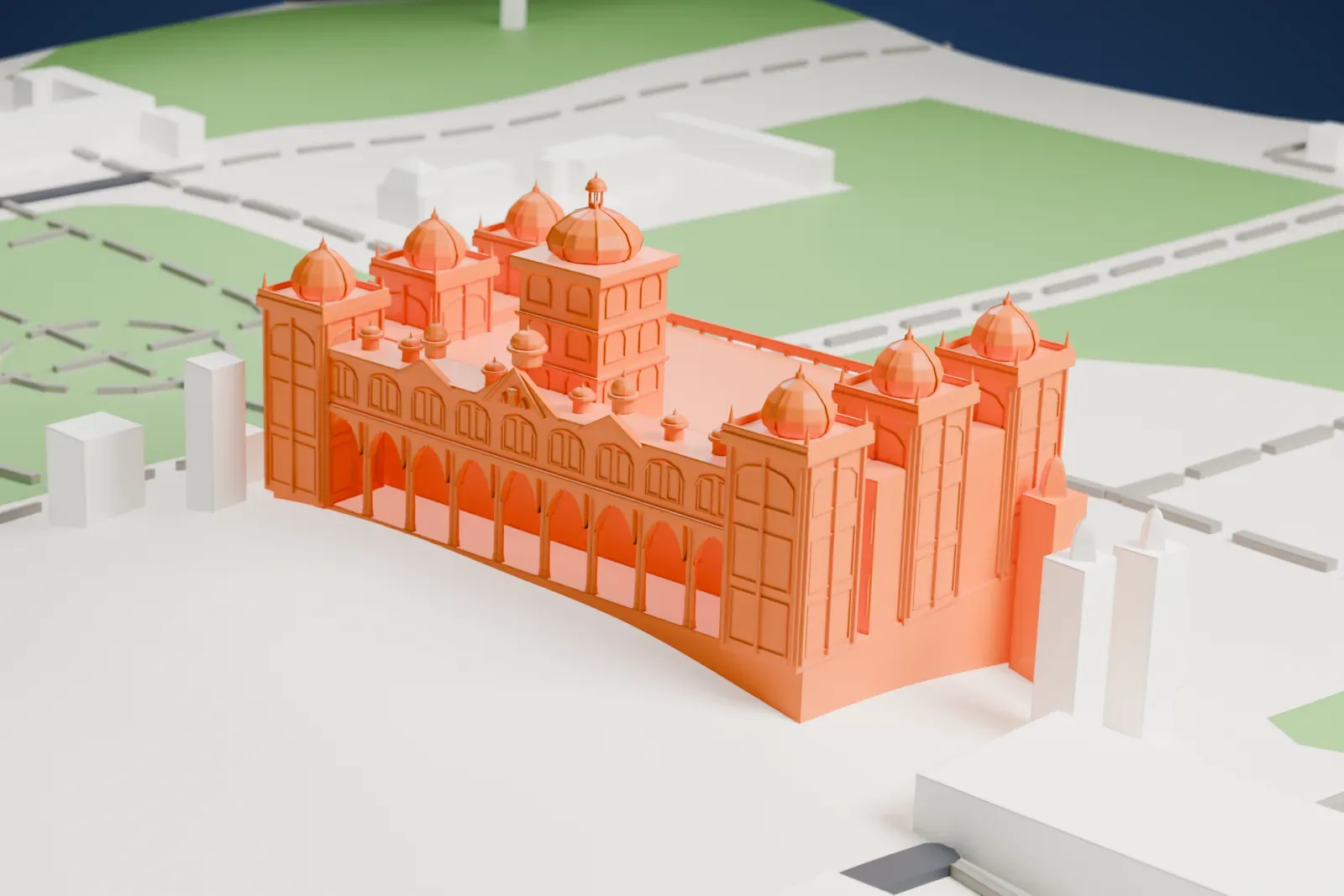 A white 3D print of Mysore Palace, a long building with domed corner towers, a taller central dome and rows of arches, standing on open ground with lawns and paths around it.