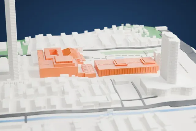 A white 3D print of the Nanjing Museum, a group of linked halls including one with a tiled hipped roof, around lawns and a small pond, with city blocks and roads beyond.