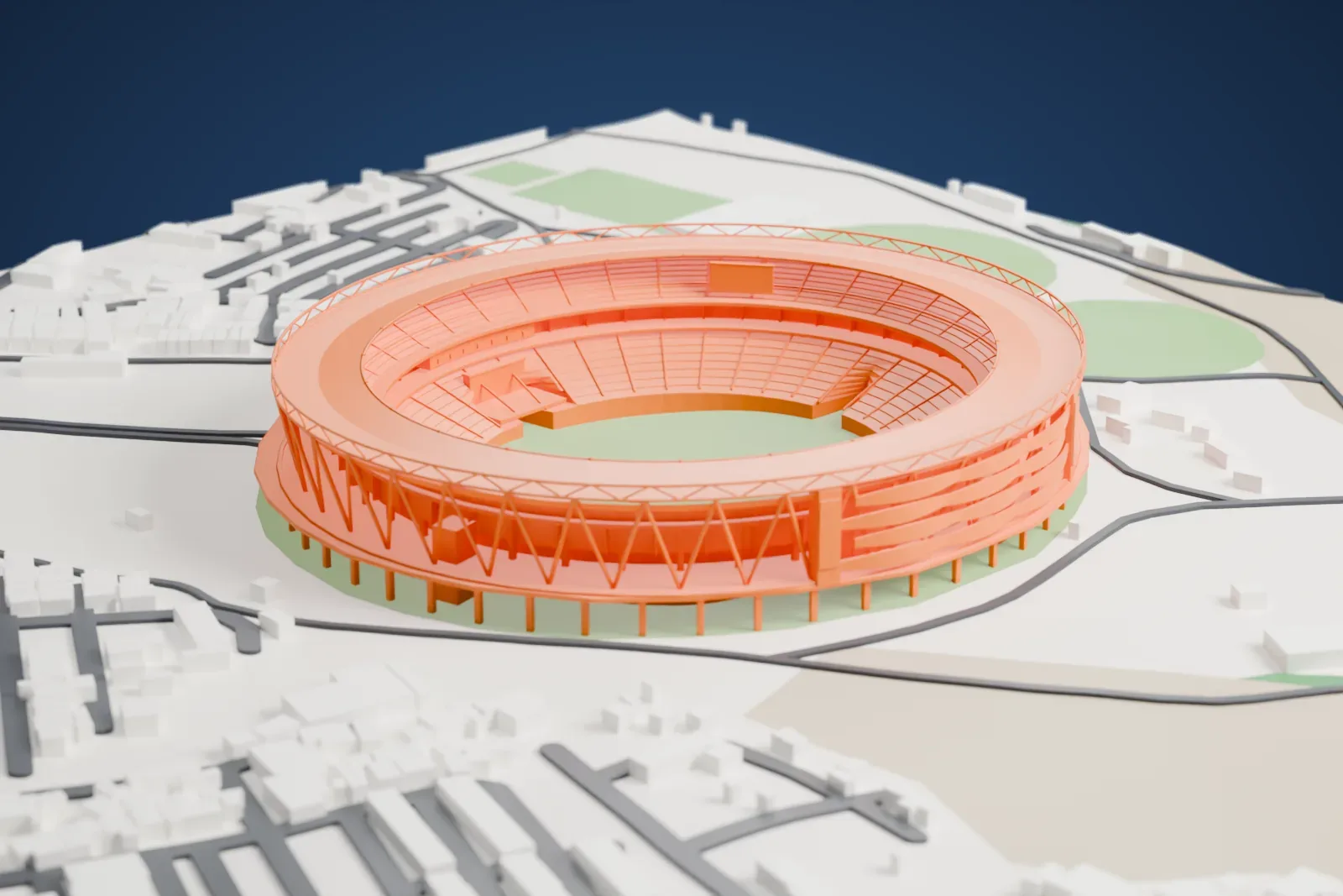 A white 3D print of Narendra Modi Stadium, a round open-topped bowl with a ring of slanted supports, surrounded by roads, grassy fields and low buildings.