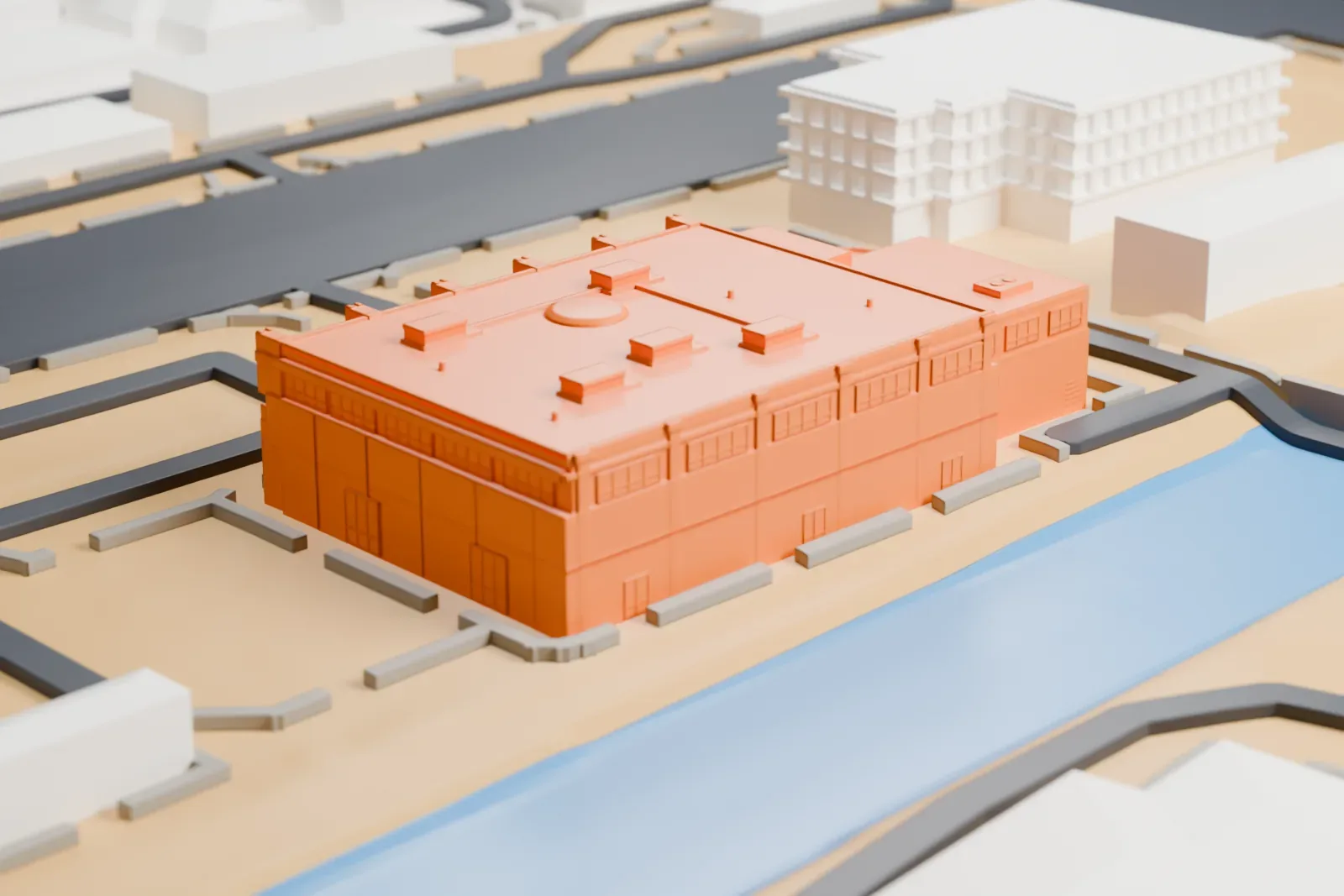 A white 3D print of the National Atomic Testing Museum, a boxy building with a curved wing and small rooftop details, standing among wide roads with a channel of water nearby.