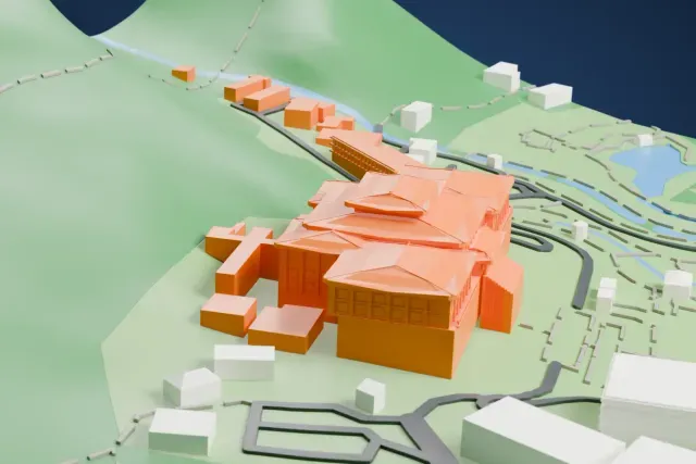 A white 3D print of the National Palace Museum, a large building with stacked, overlapping hipped roofs, on a green hillside with roads and buildings around it.