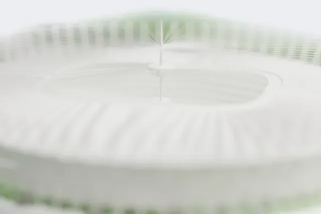 A white 3D print of the National Stadium, Warsaw model in Warsaw, with the streets around it.