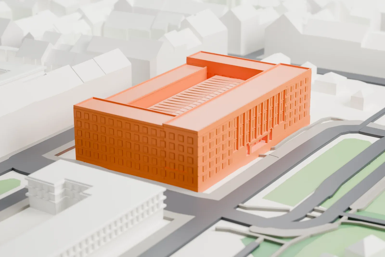 A white 3D print of the National Technical Museum in Prague, surrounded by streets and buildings.