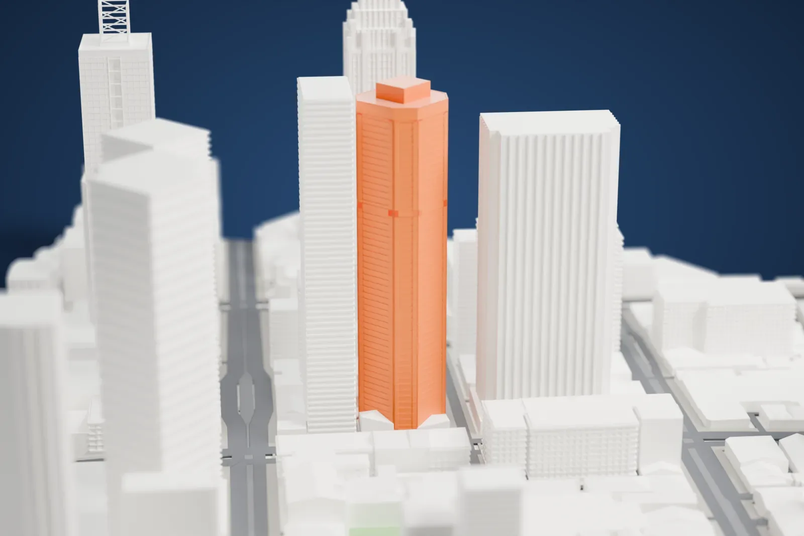 A white 3D print of Nauru House, a tall tower standing among the surrounding streets and buildings.