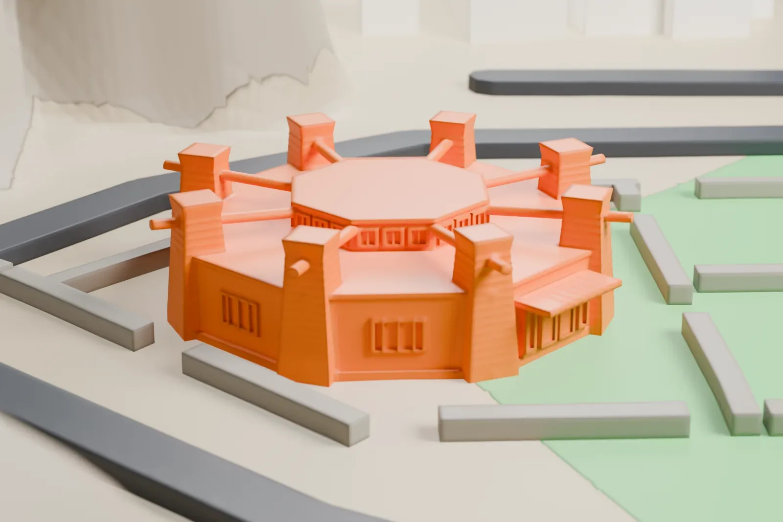 A white 3D print of the Navajo Nation Council Chamber, a low octagonal building with corner buttresses and beams projecting from its roof, on open ground beside curving roads and grassy areas.